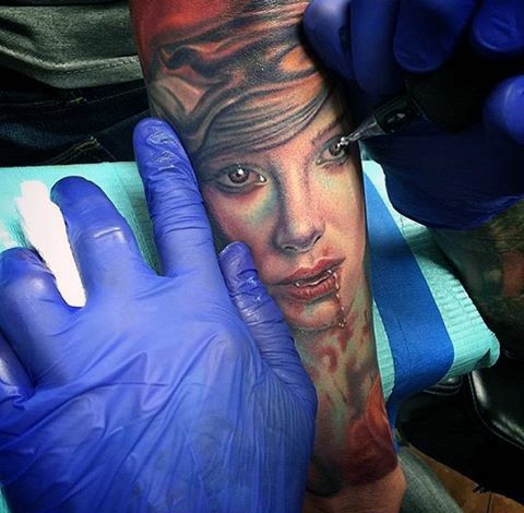 Impressive multicolored bloody woman vampire tattoo on arm