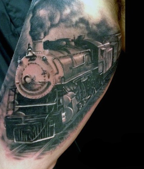 Impressive painted natural looking big old train tattoo on arm