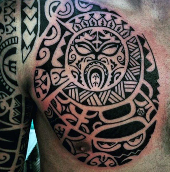 Impressive tribal style black ink ornaments tattoo on chest and shoulder