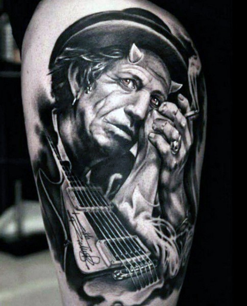 Impressive very detailed original black and white rock star tattoo on thigh