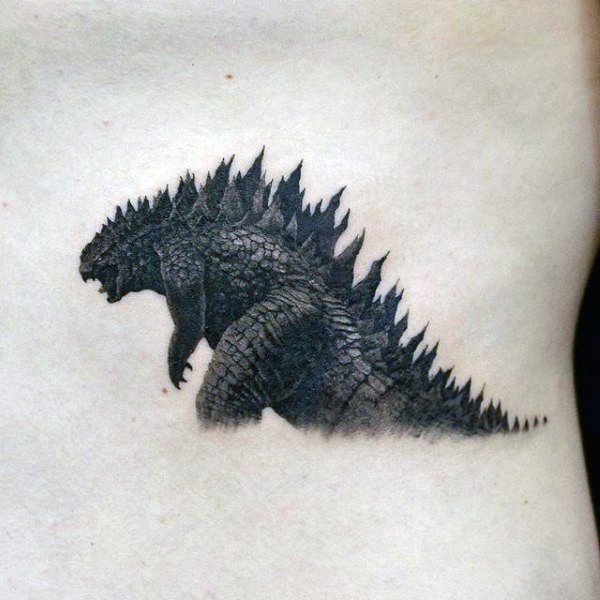 Impressive very realistic looking detailed Godzilla tattoo on back