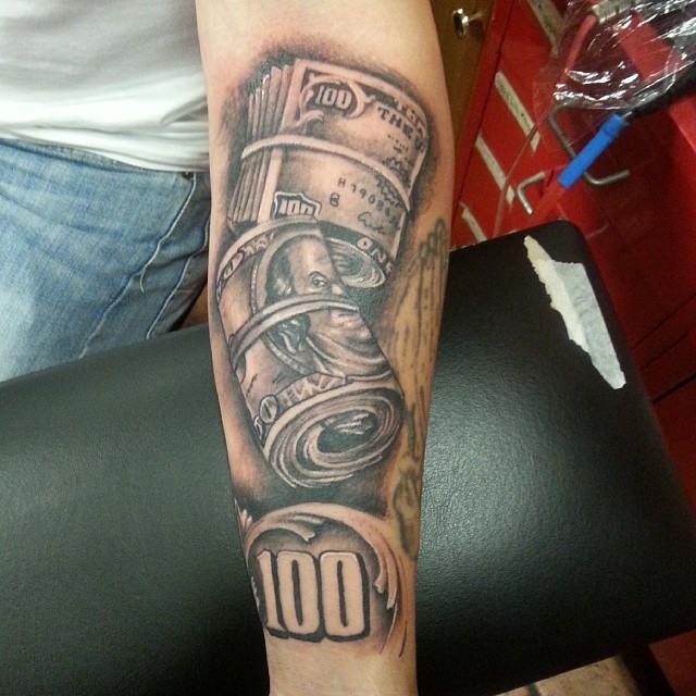 Incredible black and white detailed forearm tattoo of dollar money bill