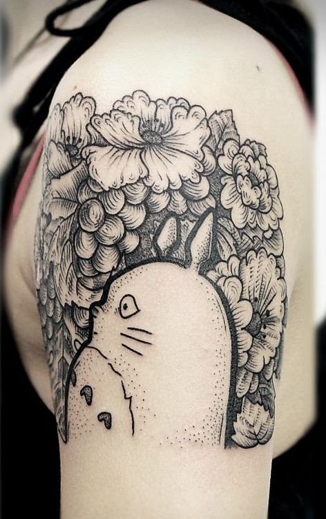Incredible black and white monster cartoon funny creature tattoo on shoulder stylized with flowers