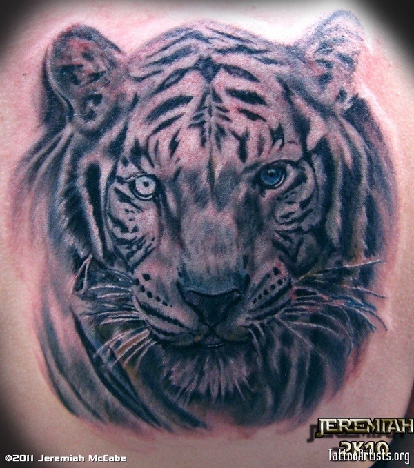 Incredible black and white natural looking white tiger head tattoo