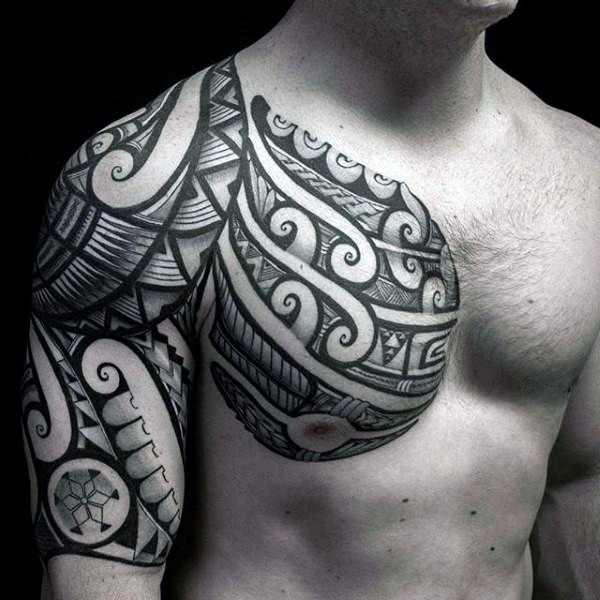 Incredible black and white tribal ornaments tattoo on chest and shoulder