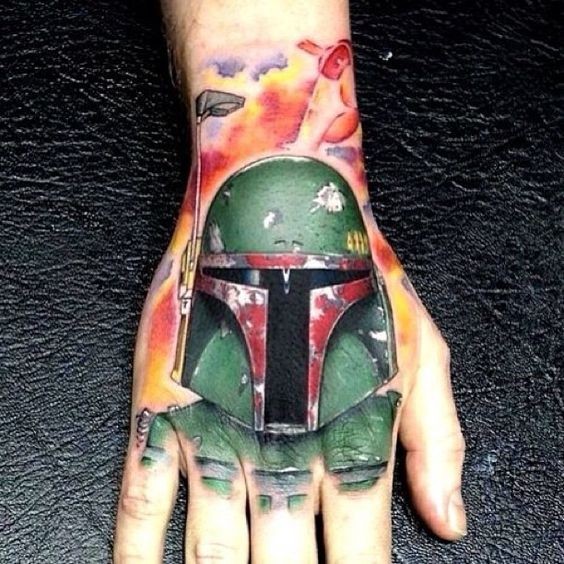 Incredible colored and detailed hand tattoo on Boba Fett
