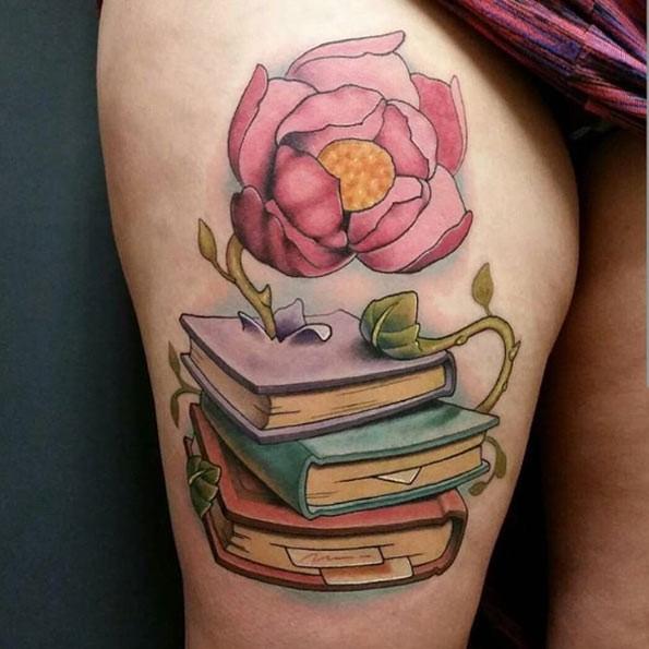 Incredible colored big fantasy flower on thigh tattoo stylized with books