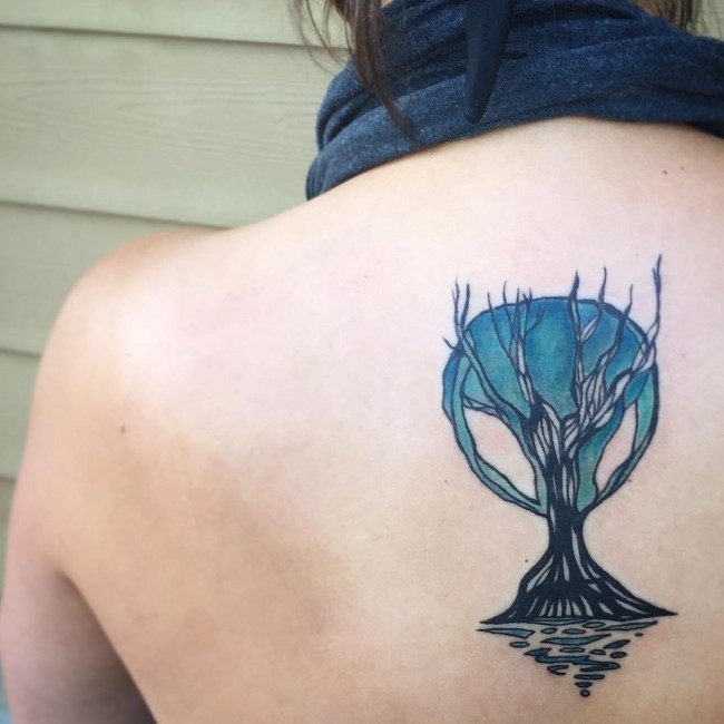 Incredible colored fantasy little tree tattoo on back