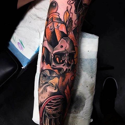 Incredible colored human skull tattoo on forearm combined with eagle