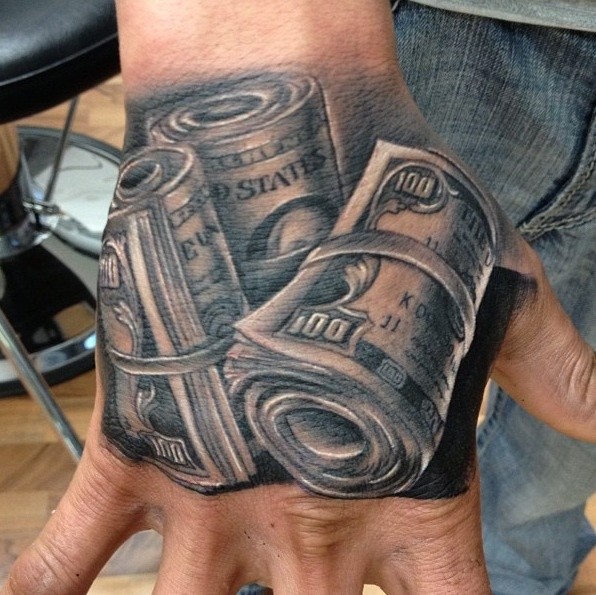 Incredible colored very detailed American money tattoo on hand