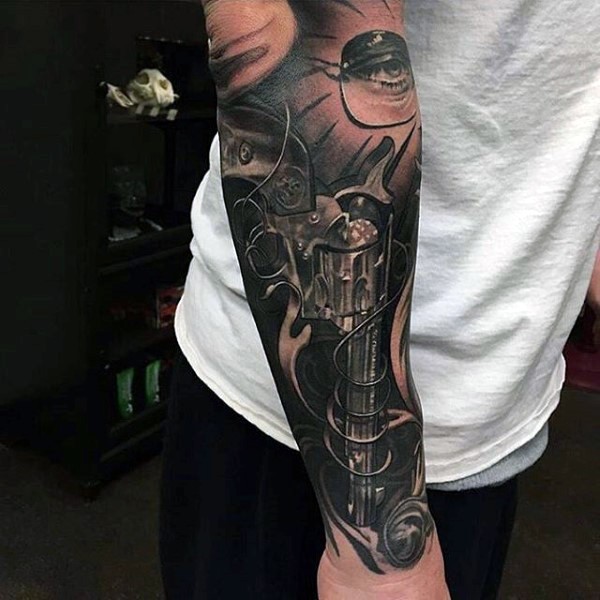 Incredible looking 3D style very detailed forearm tattoo of antic revolver