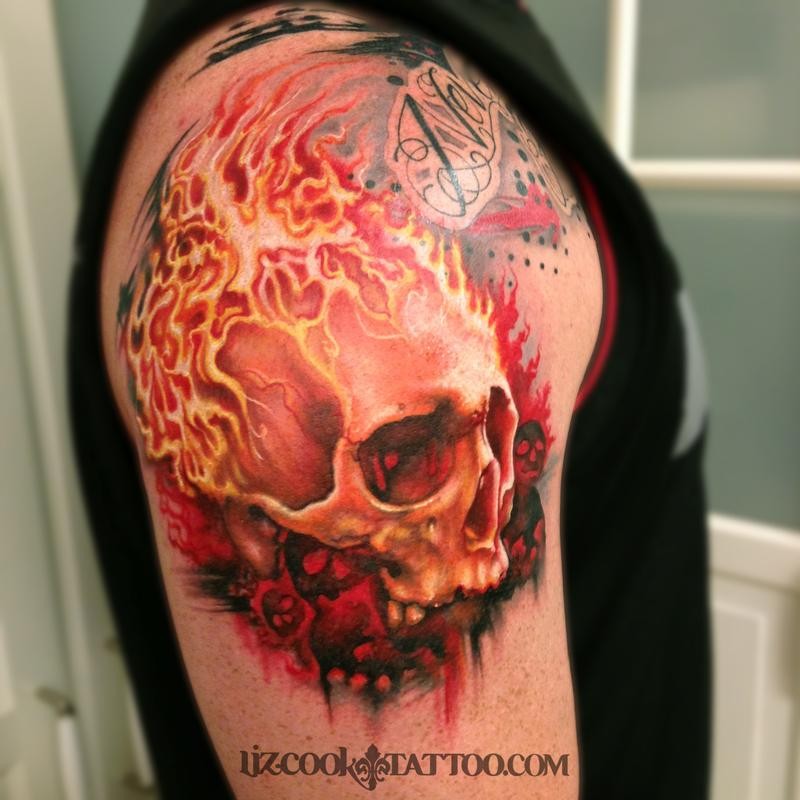Incredible looking colored burning human skull tattoo on shoulder