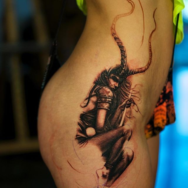 Incredible looking detailed thigh tattoo of demonic woman