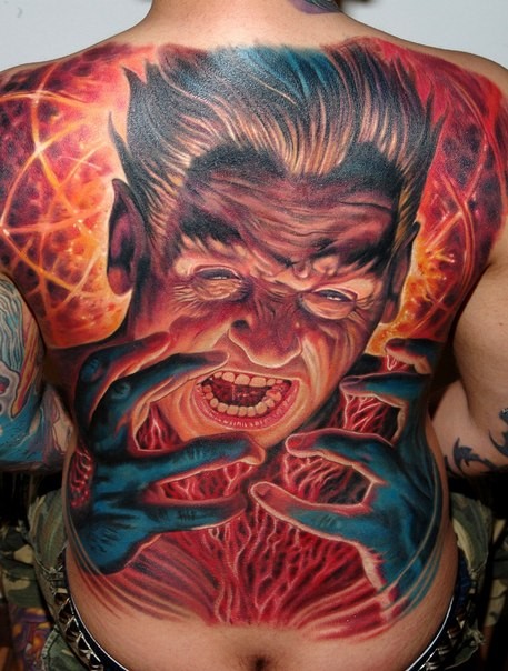 Incredible multicolored whole back tattoo of evil wizard