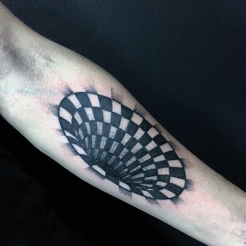 Incredible painted black and white hypnotic tattoo on arm