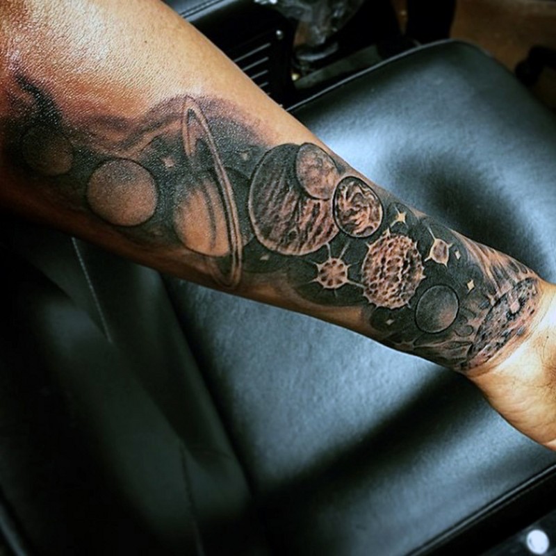 Incredible painted black and white solar system tattoo on arm