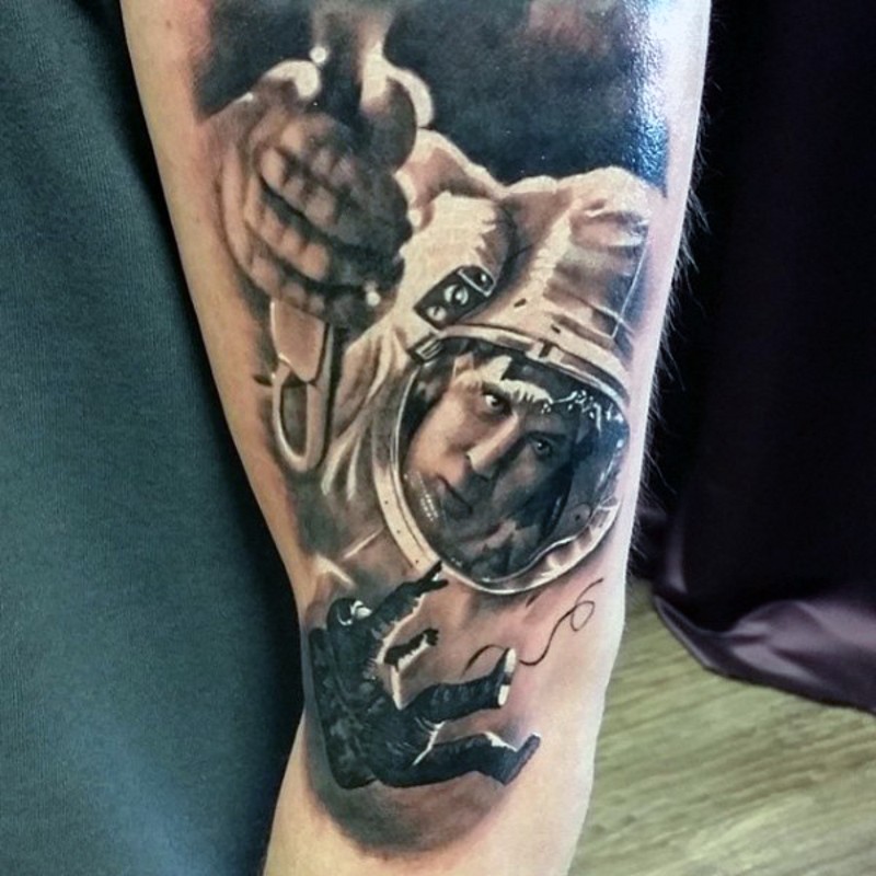 Incredible painted colored astronaut tattoo on arm