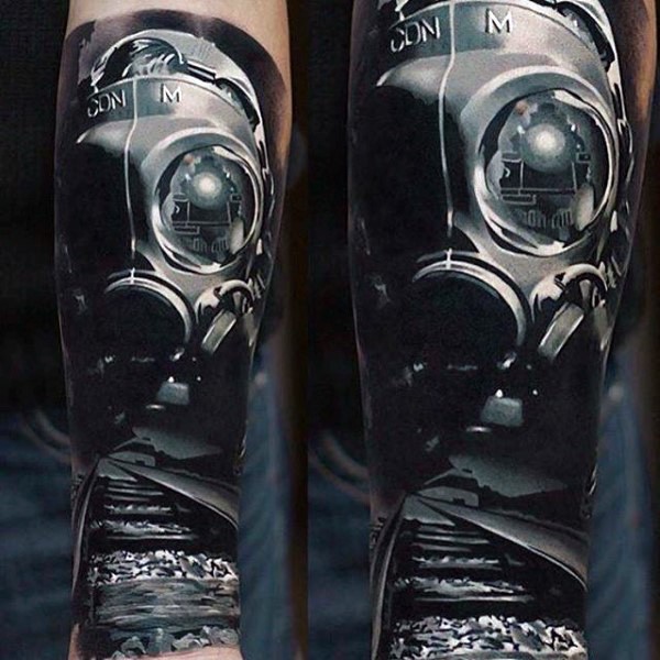 Incredible painted very detailed black and white gas mask with railroad tattoo on sleeve