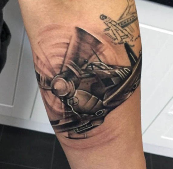 Incredible realism style colored WW2 fighter plane tattoo on arm