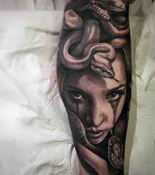 Incredible very detailed black and white Medusa tattoo on leg