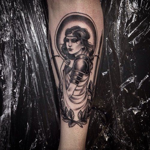 Incredible vintage style black ink medieval woman knight forearm tattoo stylized with leaves