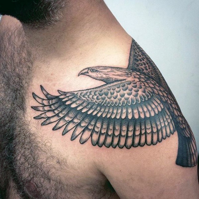 Indian traditional painted black ink detailed eagle tattoo on shoulder