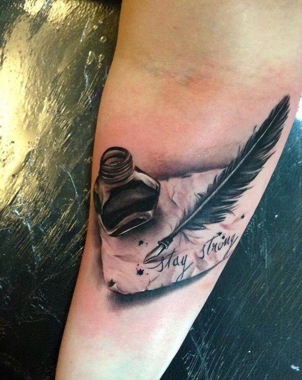 Inkwell with a feather and writing forearm tattoo