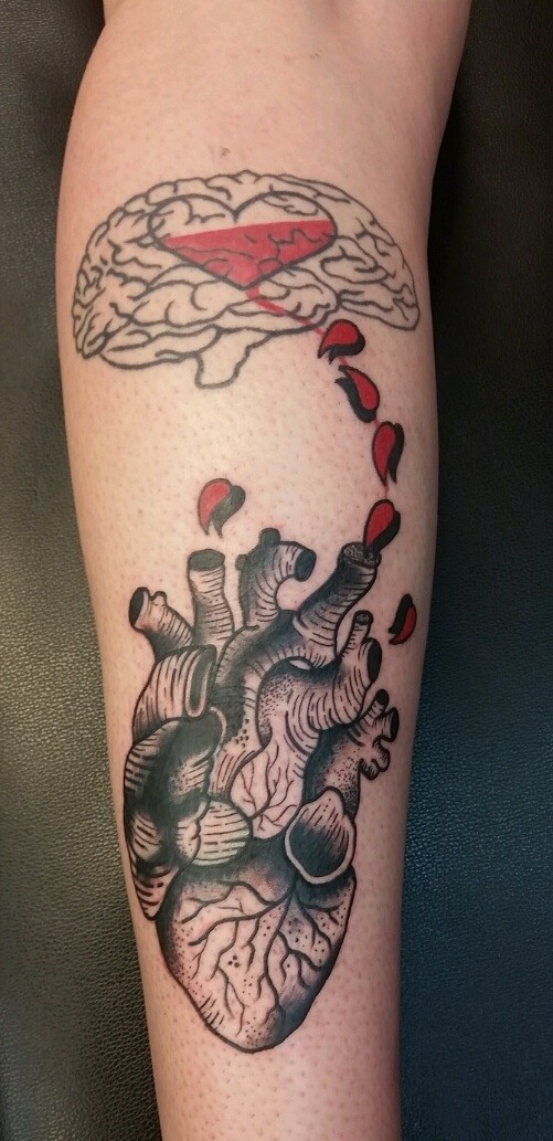 Interestign combined black ink human brain with heart tattoo on leg