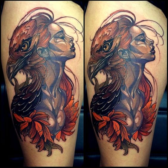 Interesting colored big thigh tattoo of seductive woman with eagle head
