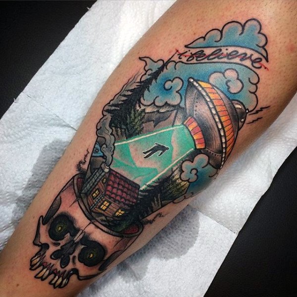 Interesting combined and colored big alien ship with human and skull tattoo on leg