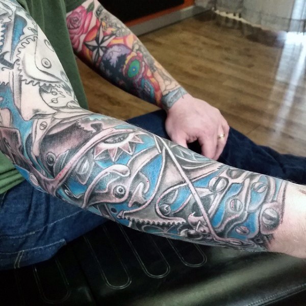 Interesting design colored biomechanical style colored sleeve tattoo