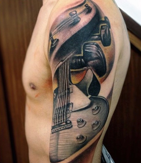 Interesting designed and colored big cool guitar tattoo on sleeve area