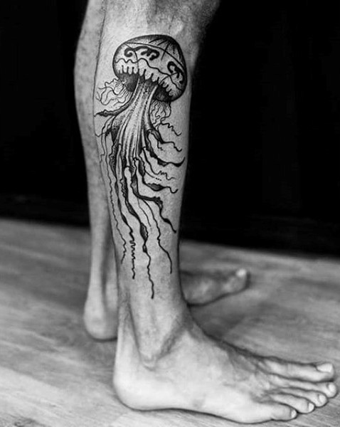 Interesting designed big black and white jellyfish tattoo on leg