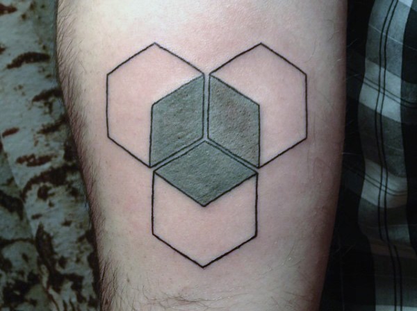 Interesting looking colored geometrical tattoo on leg