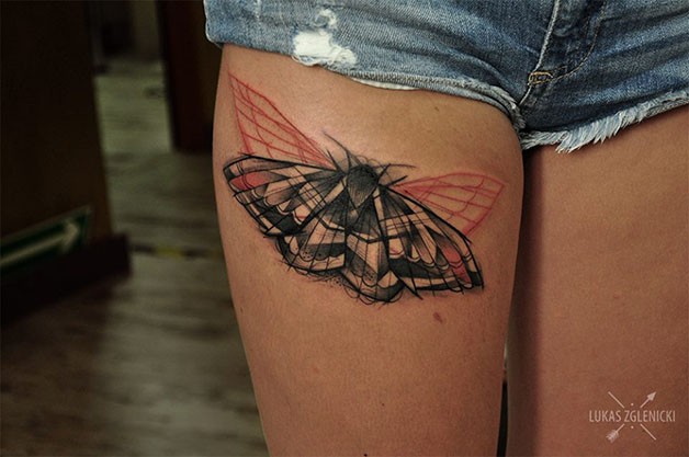 Interesting looking colored thigh tattoo of beautiful butterfly