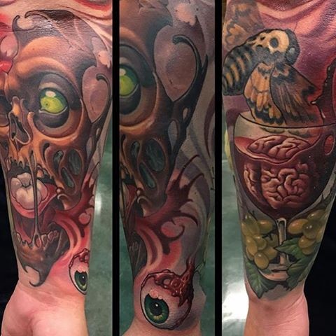 Interesting looking colorful forearm tattoo of various horror movies attributes