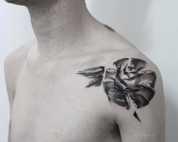 Interesting looking sketch style shoulder tattoo of big rose