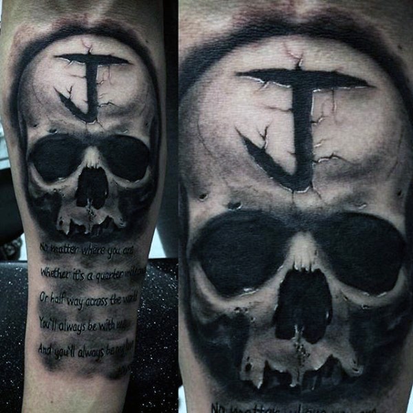 Interesting looking skull tattoo on forearm with lettering