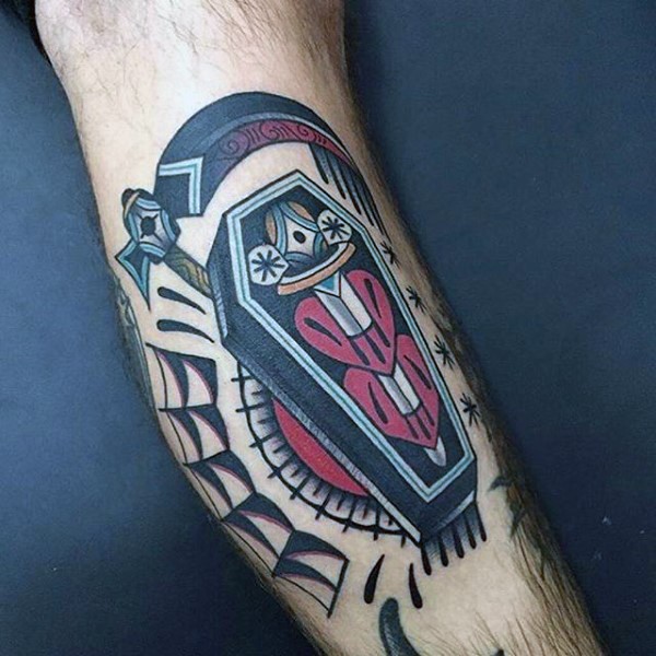Interesting multicolored little coffin with sword and heart tattoo on leg