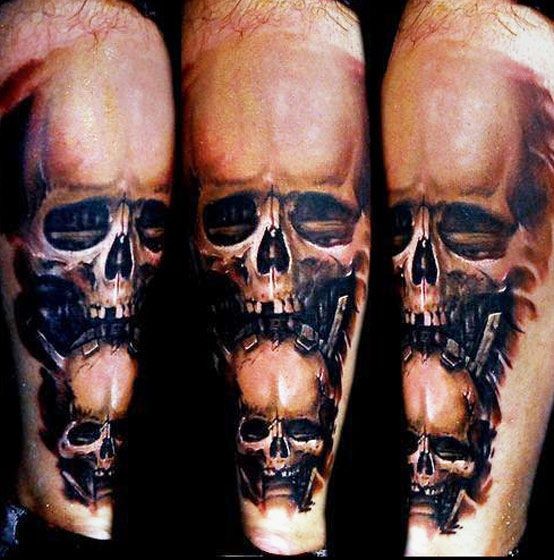 Interesting painted 3D style colored leg tattoo of human skulls