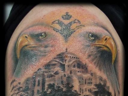 Interesting painted and colored big antic city tattoo on shoulder combined with eagles
