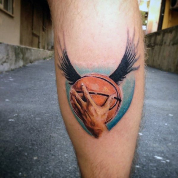 Interesting painted and colored leg tattoo of basketball with wings