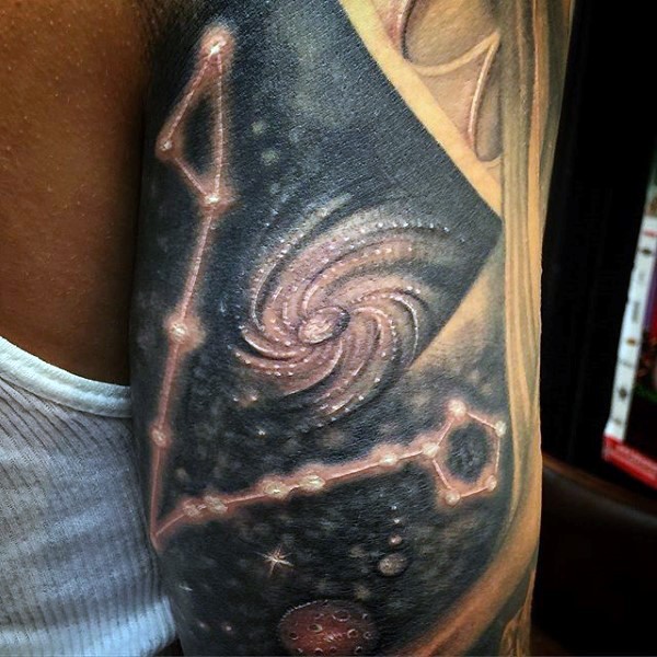 Interesting painted detailed and colored galaxy tattoo on arm