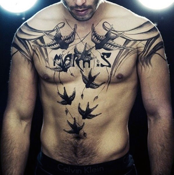 Interesting painted various black ink birds with lettering tattoo on chest