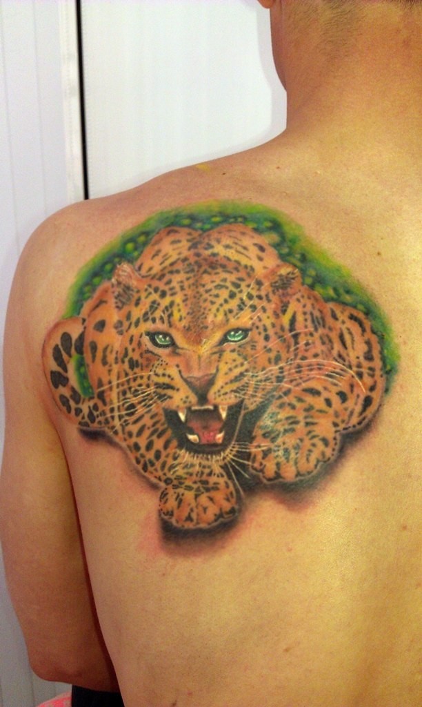 Jaguar growls tattoo on shoulder blade