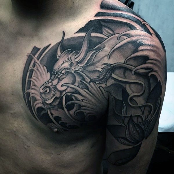 Japanese traditional black ink shoulder and chest tattoo of big fantasy dragon