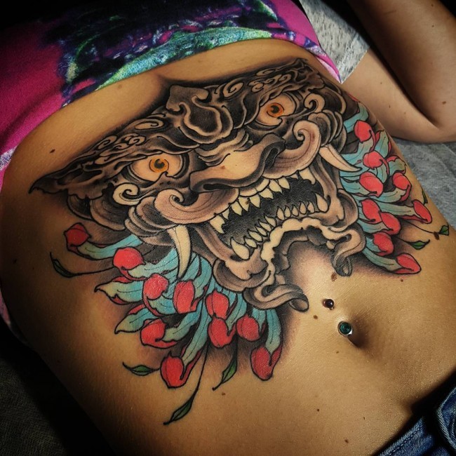 Japanese traditional style black and white belly tattoo with flowers