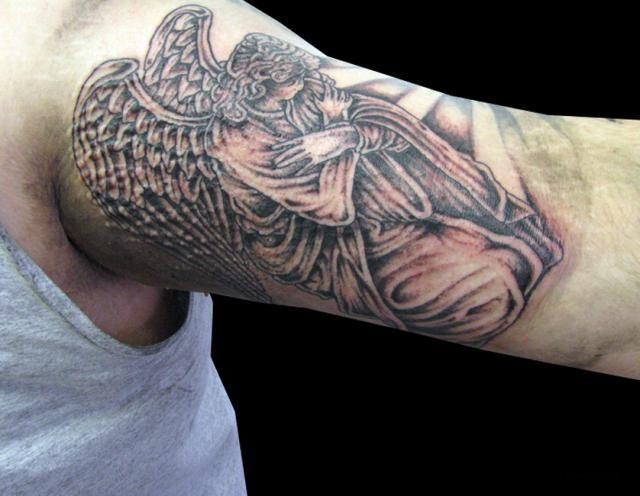 Kneeling angel tattoo on half sleeve