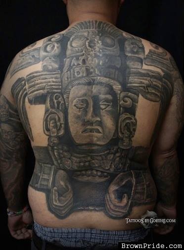 Large black and white whole back tattoo of stone statue