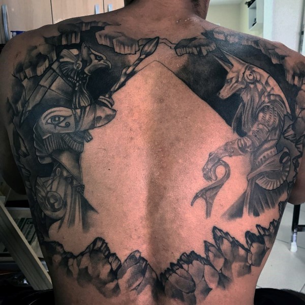 Large black ink back tattoo of various Egypt Gods